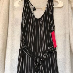 Never worn, sleeveless jumpsuit.